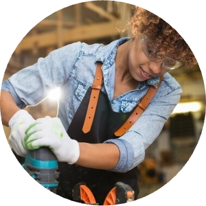 woman using a power tool for construction